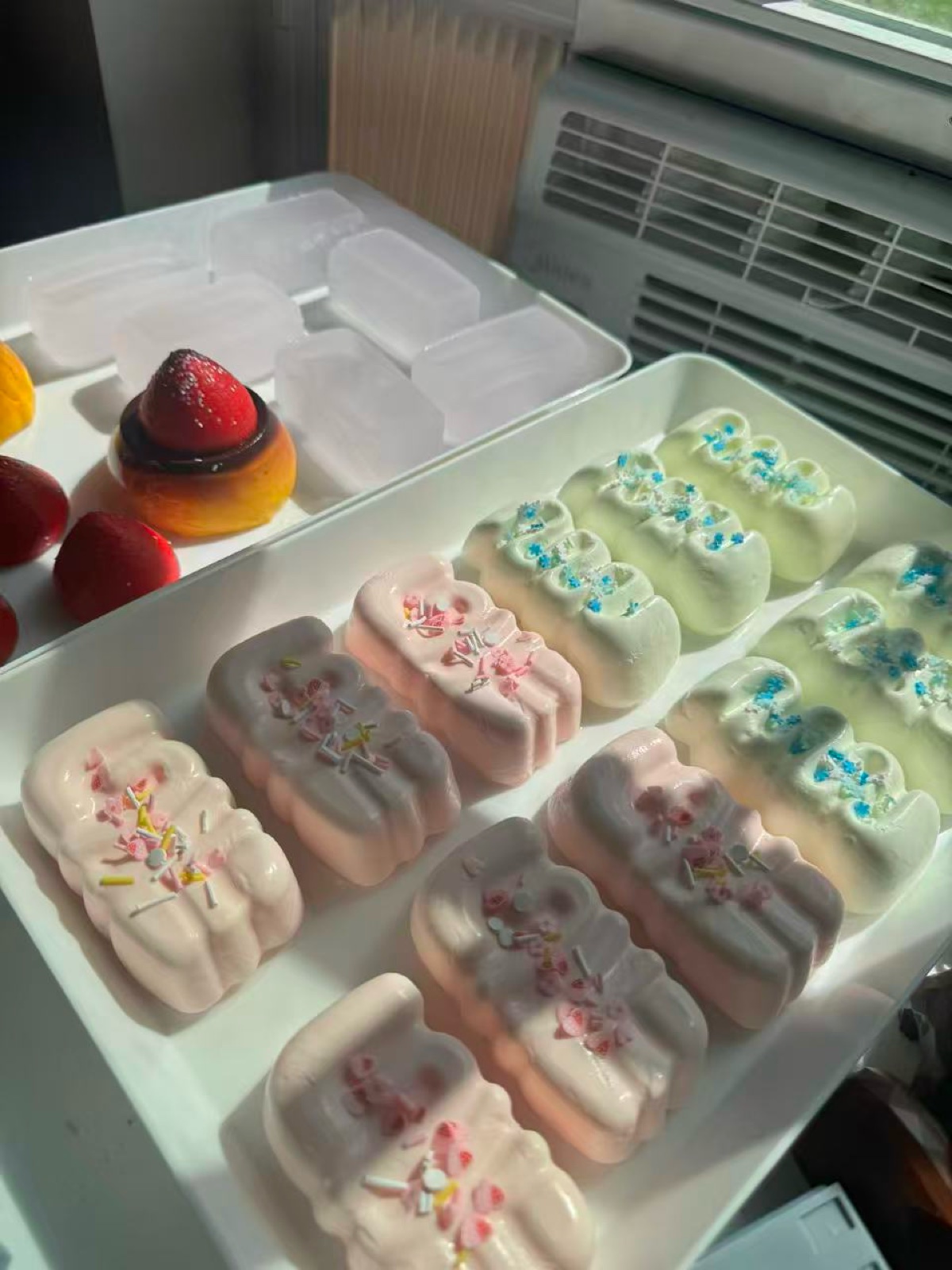 Pastel silicone pastry squeeze toys arranged on trays